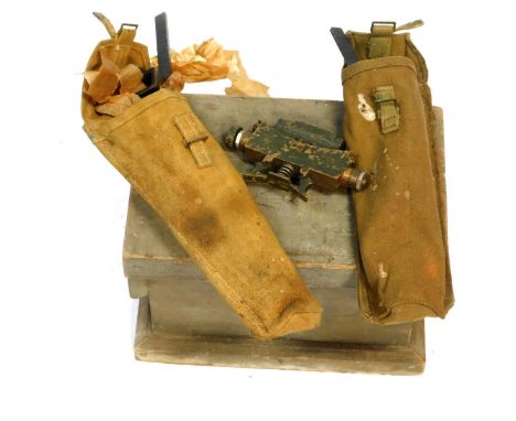 A World War I wooden box, World War II 1944 dated clinometer, and associated equipment. 