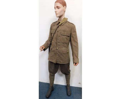 A male mannequin wearing British Army uniform. 