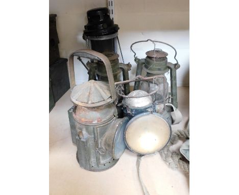 A 1945 dated military lamp, and other associated examples. 