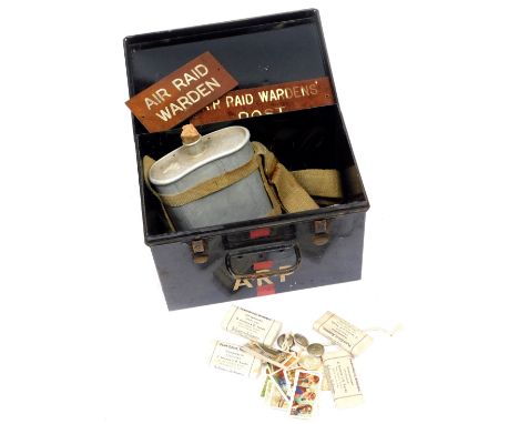 A World War II ARP first aid tin, cigarette cars, bandages, door signs, etc. 