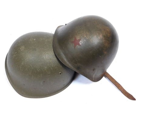 Two military helmets, to include a Russian Army example. 