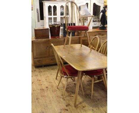 Ercol Windsor six piece dining suite comprising three door sideboard, rectangular dining table and four Quaker back chairs.