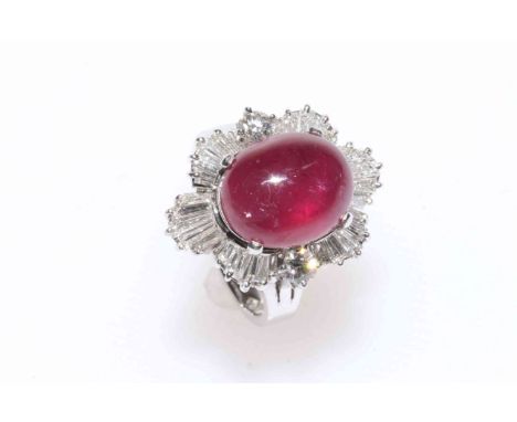 14 carat white gold, ruby and diamond ballerina style cluster ring featuring oval cabochon ruby, approximate 6.42 carat with 