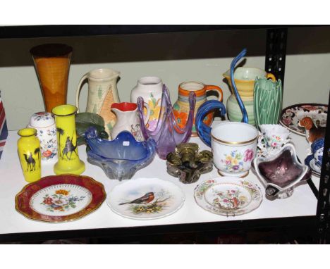 Shelf of retro glass, plates, planters, etc.