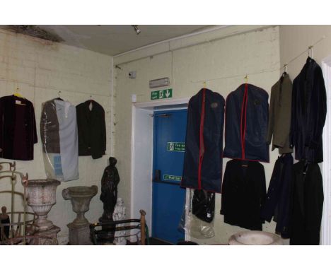 Collection of vintage clothing, riding boots and top hats.