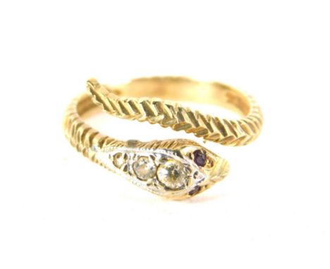 A serpent ring, the eyes picked out with garnets, the head in white stones, unmarked.