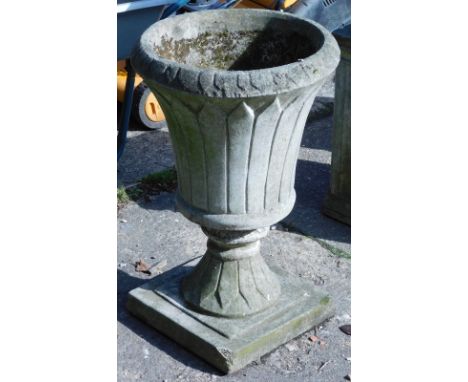 A composite urn planter, classical style on square plinth base, 68cm high, 45cm diameter. 