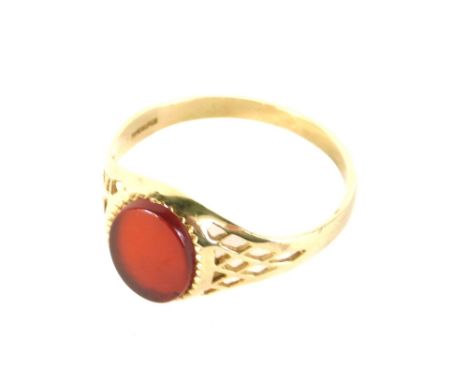 A 9ct gold dress ring, set with polished oval orange stone, 2g all in. 