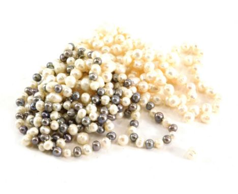 A group of pearls, comprising a two colour natural pearl necklace, with knotted strand and grey and cream finish beads, 148cm