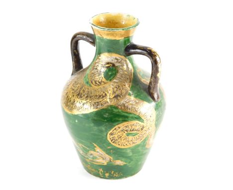 An unusual 19thC pottery two handled vase, hand painted with serpent on green ground, with R diamond mark beneath, numbered 1