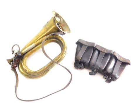 A 20thC brass bugle, with mouth piece, the end marked 2LLR RIR68K 22cm high and a leather belt attachment bullet pouch.
