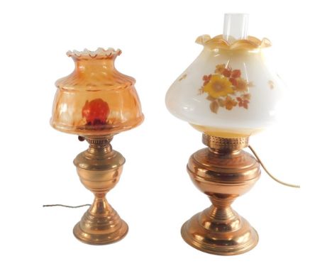 A 20thC Duplex oil lamp, with amber coloured glass shade and electrical feature 39cm high and another similar. (2) Buyer Note