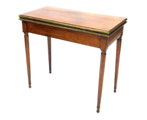 A 19thC continental mahogany card table, the rectangular top with a moulded brass border, above a plain frieze, on turned tap