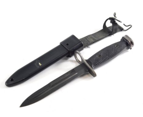 A 20thC Mio 8448476 dagger, with textured handle and scabbard, 29cm long. 