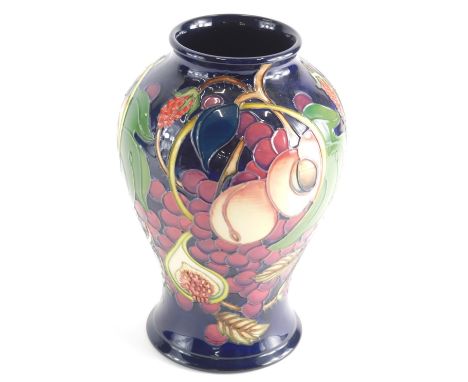 20thC Moorcroft Vase decorated with fruit and berries impressed and painted marks beneath, 26cm high.