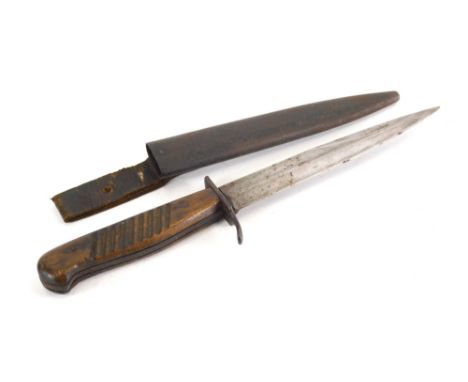 A 20thC dagger, with part textured handle and shaped scabbard, 26cm long. 