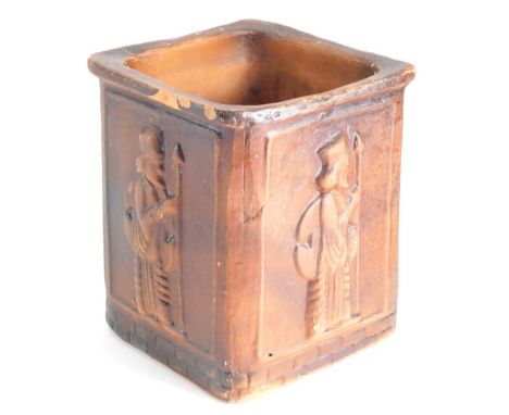 A 20thC pottery planter, raised with various figures 23cm high.