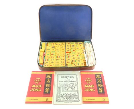 A late 20thC mahjong set, with resin tiles in case 33cm wide.