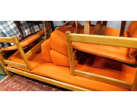 A vintage Habitat teak three piece suite, comprising two armchairs, 71cm high. and three seater daybed, in orange material, p