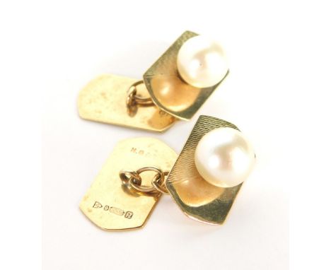 A pair of 9ct gold gents cuff links, each with rectangular shield, half engine turned detailing and applied cultured pearl wi