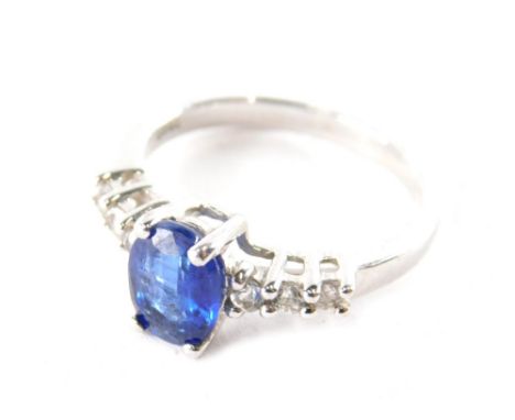 A silver Himalayan kyanite and white topaz ring, the oval cut kyanite flanked by three topaz to each side, ring size O, with 