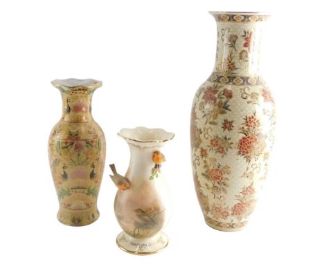 A Bradford Exchange vase, 23cm high, and two matched graduated Chinese vases raised with flowers and birds. (3) 