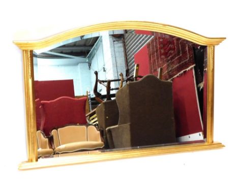 A modern gilt coloured overmantel mirror, with bevelled glass and acanthus capped columns, 78cm high, 116cm wide.
