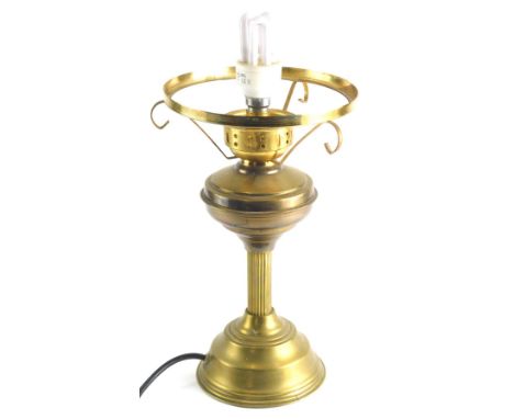 A 20thC brass oil lamp, with reeded column and electrical feature, 40cm high.