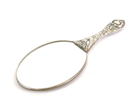 A 20thC hand mirror, heavily repousse decorated with flowers and scrolls, with plain bevel glass, 24cm long. 
