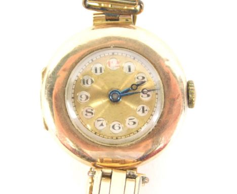 A 1950's 9ct gold cased wristwatch, the circular dial with numeric outer chapter ring and blue hands, with half Hunter type f