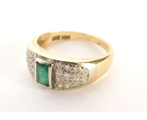 An emerald and diamond ring, the rectangular cut emerald in a rub over setting, with twenty four round brilliant cut tiny dia