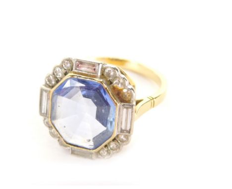 A sapphire and diamond Art Deco dress ring, the octagonal shallow sapphire in a rub over setting, measuring 10.5mm x 12mm, su