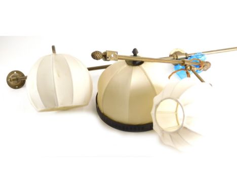A set of brass light fittings, a brass rail light fitting, a matching ceiling light and an adjustable wall light.
