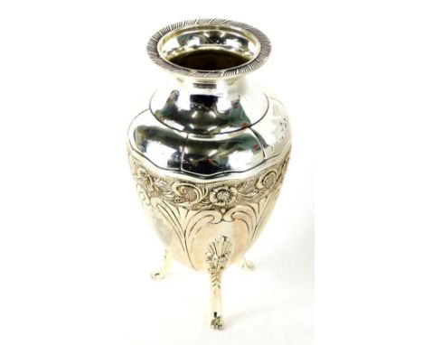 A 20thC silver plated vase, with compressed stem, repousse decorated with scrolls on paw feet etched with flowers, 20cm high.