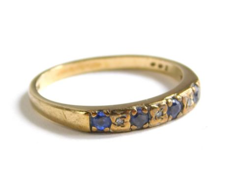 A 9ct gold dress ring, set with blue and white stones. 