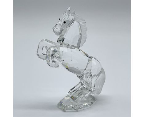 This retired Swarovski crystal white stallion was part of the “Horses on Parade” collection and is made from clear crystal wi