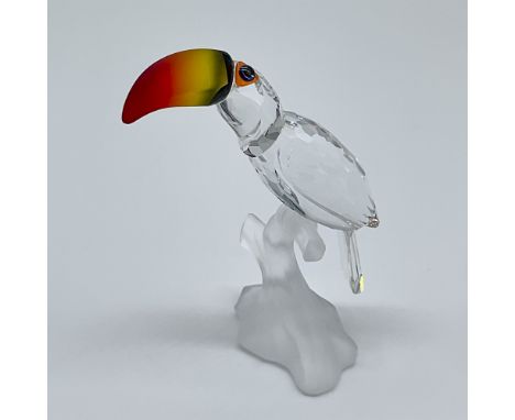 This stunning Swarovski crystal "Toucan" figurine, designed by Michael Stamey, was introduced in 1999 and produced until 2009
