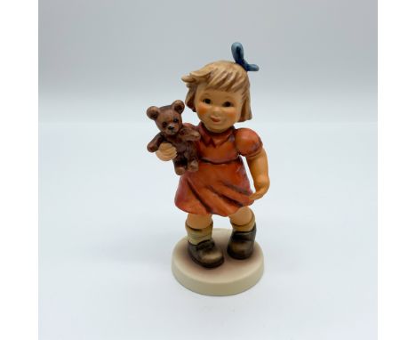 Goebel Hummel figurine Shall We Dance? (2177), featuring a young girl in a red dress with a teddy bear. A Premier Edition pie