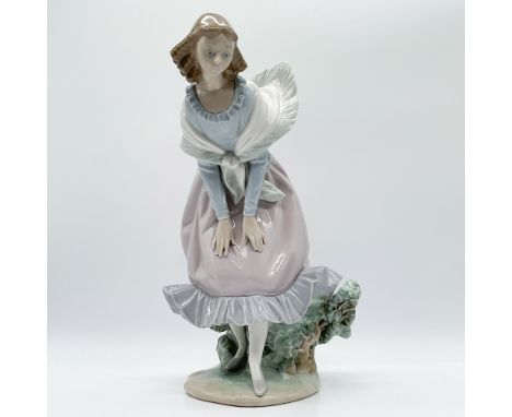 A captivating Lladro porcelain figurine titled March Winds, designed with exceptional detail and grace. This delicate piece p