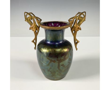 This stunning Art Nouveau vase features a shimmering iridescent glass body that transitions with hues of green, blue, and pur