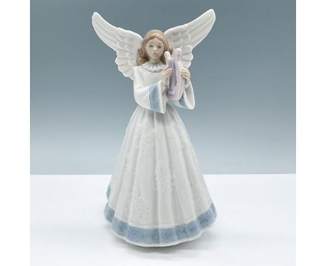 Lladro porcelain figurine 5830, Heavenly Harpist, featuring an angelic figure gracefully playing a harp. The figurine is ador