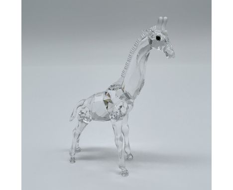This Swarovski Baby Giraffe figurine, item number 236717, is a captivating creation from Swarovski's African Wildlife series.