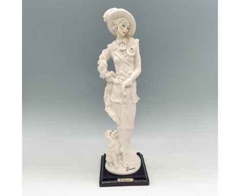 Exquisite Giuseppe Armani porcelain figurine depicting an elegantly dressed lady with a poodle. This finely crafted sculpture