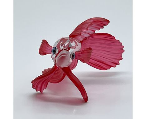 Presenting an exquisite Swarovski figurine, a retired collectible that perfectly captures the elegance and vibrant beauty of 