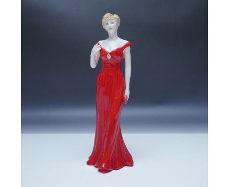 A Royal Worcester porcelain figurine commemorating Diana, Princess of Wales, elegantly posed in a striking red gown. Issued i