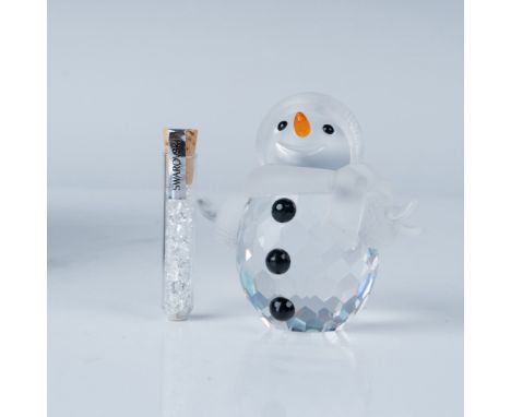 This delightful Swarovski crystal snowman figurine captures the joy and whimsy of the winter season. Expertly crafted, this p