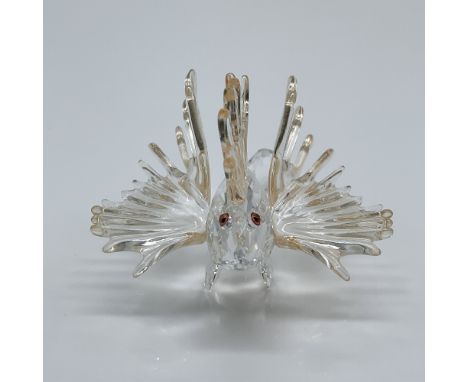 This exquisite Swarovski crystal figurine showcases a detailed and shimmering representation of a lionfish, a piece that beau