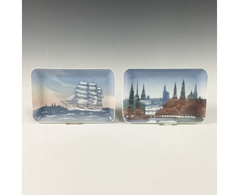 A pair of collectible rectangular trays by Bing &amp; Grondahl. The first tray, titled Skoleskinet - Danmark, showcases a stu