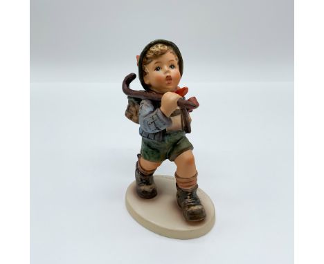 Hummel The Runaway (Model 327) depicts a young boy setting off on an adventure with a walking stick and backpack. Hand-painte