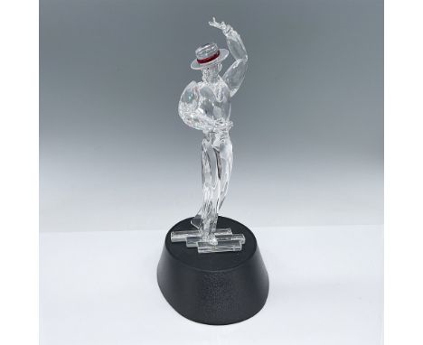 Swarovski crystal figurine from the Magic of Dance collection, titled "Antonio," featuring a dynamic pose with a red-tipped h